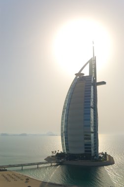 Burj al Arab hotel during sunset clipart