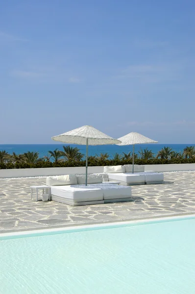 stock image Beach beds near swimming pool