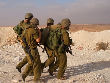 Israeli soldiers excersice in a desert clipart