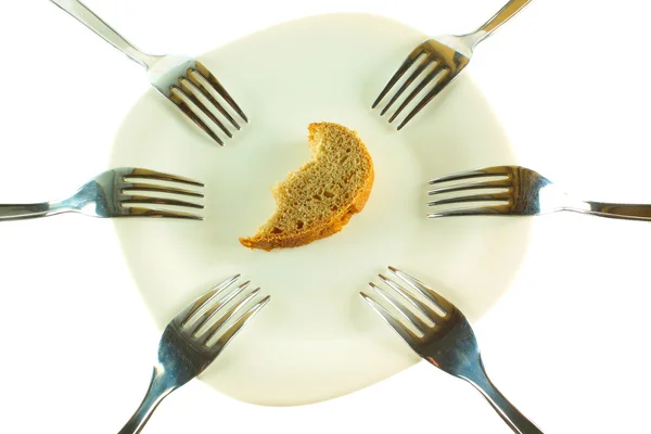 stock image Six forks and a crust of a bread