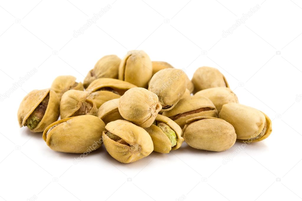 Heap of Pistachios isolated on a white b