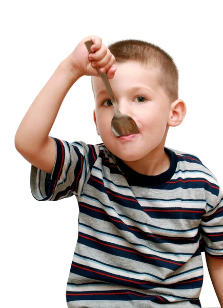 一把勺子在嘴里的小男孩 — 图库照片