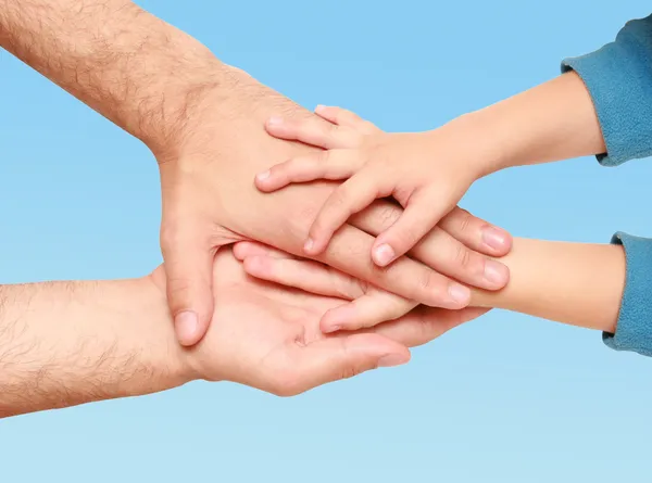 Hands of child in hands of adult — Stock Photo, Image