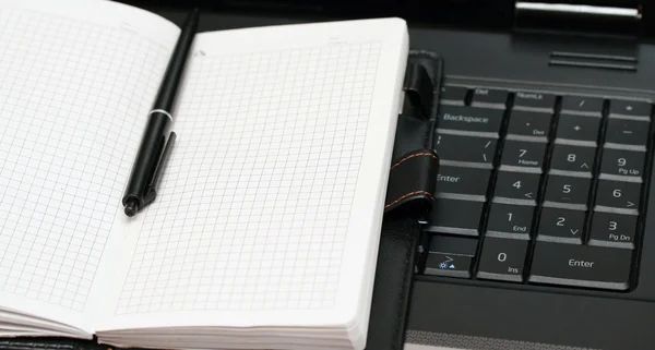 Note book lies on the keyboard — Stock Photo, Image
