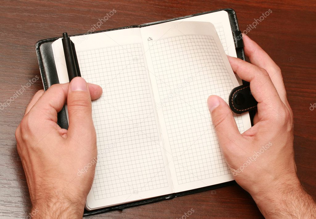 Hands with a notebook