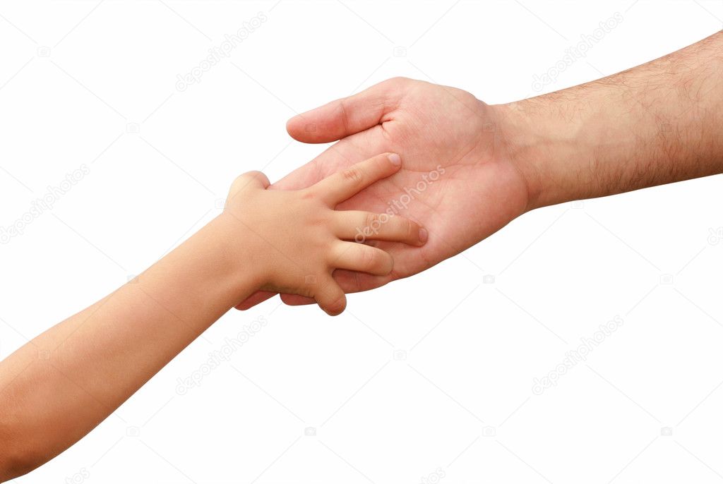 Hand of the child in hands of an adult