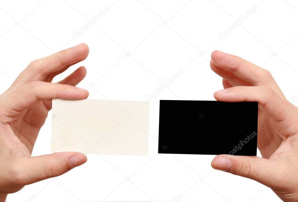 Two business cards in hands