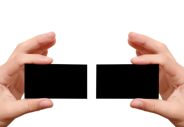 Dois cartões de visita pretos nas mãos — Fotografia de Stock