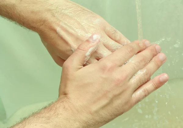 stock image Washes hands