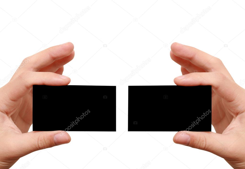 Two black business cards in hands