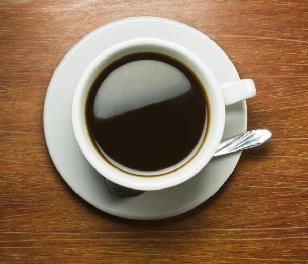 Kaffeetasse mit Holztisch — Stockfoto