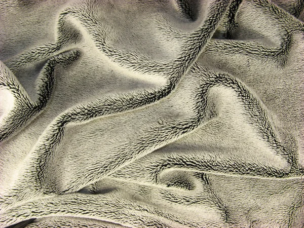 Pomarszczony lśniącą sierść czarny płaszcz tkaniny — Zdjęcie stockowe