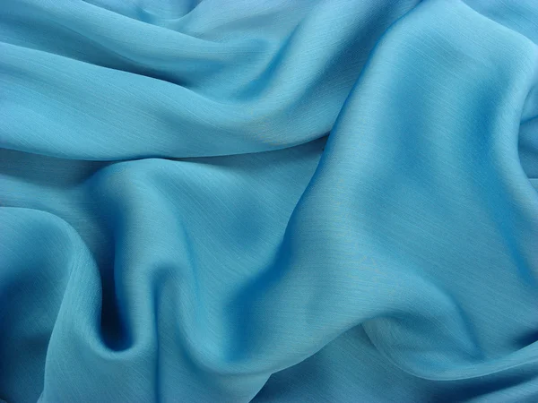 stock image Wrinkled shiny blue fabric