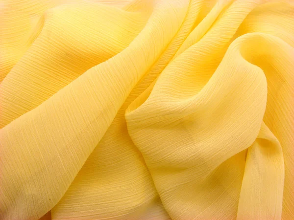 Stock image Wrinkled shiny yellow blue fabrics