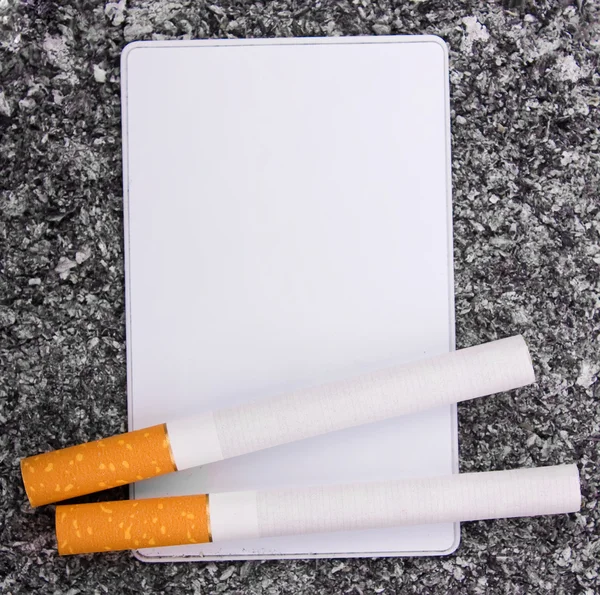 Cigarettes and card — Stock Photo, Image