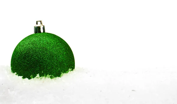 Green Christmas ball with snow — Stock Photo, Image