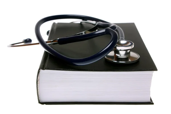 stock image Stethoscope on book