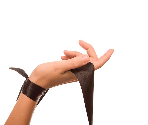 Hand with a black silk tape — Stock Photo, Image