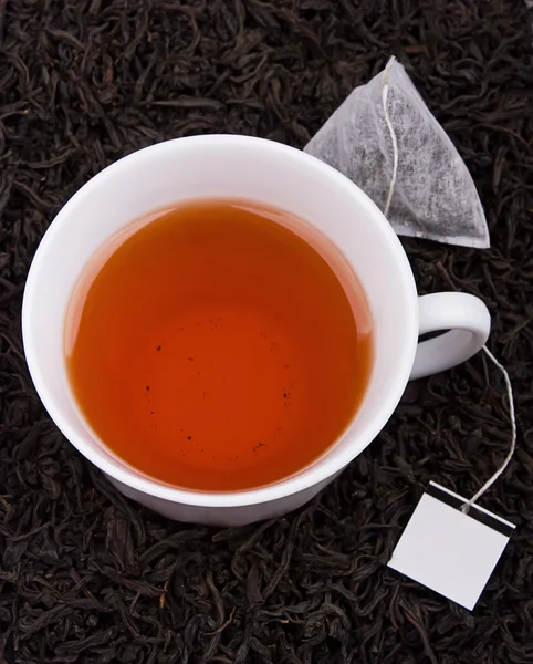 Xícara de chá com saco de chá — Fotografia de Stock
