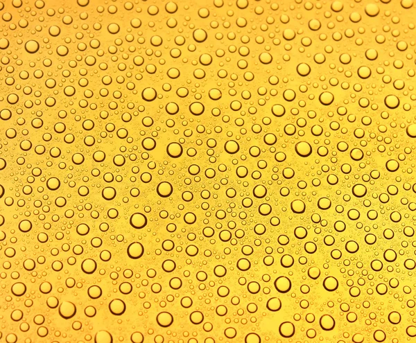 Fondo amarillo de gotas de agua —  Fotos de Stock