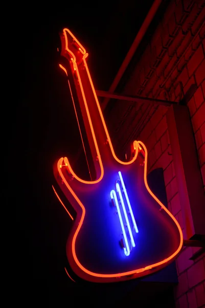 Guitarra néon vermelho — Fotografia de Stock