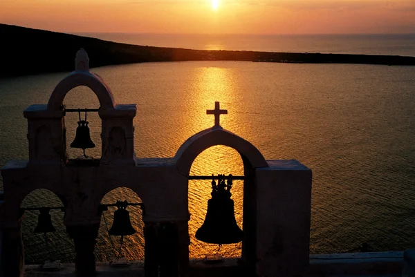 ギリシャ サントリーニ島に沈む夕日 ストック写真