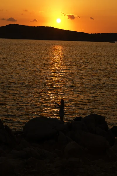 Pesca sul morbido tramonto sulla Sardegna — Foto Stock