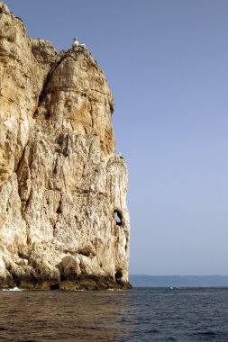 Beacon on a rock, Sardinia, Alghero clipart
