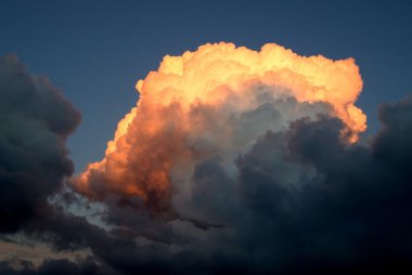 Orange cloud on a sunset clipart