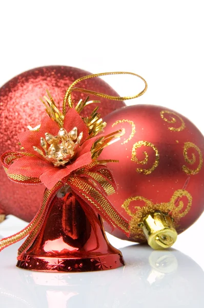 Red christmas balls and handbell — Stock Photo, Image