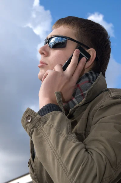 stock image Young man speaks on the phone