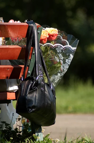 stock image Handbag and bunch of flowers