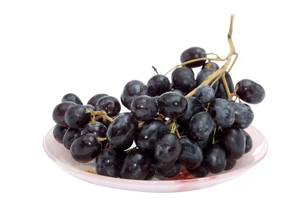 stock image Bunch of grapes on the plate