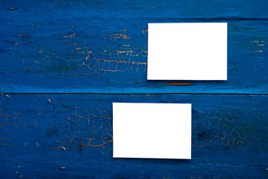 Two blank white paper cards on the blue clipart