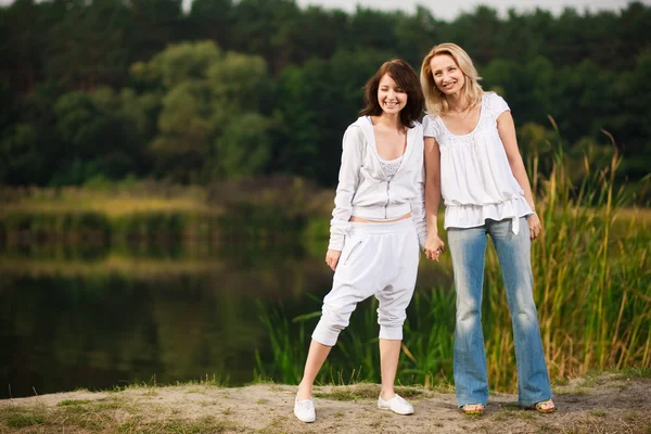 Autumn portrait of mother and daughter — Stock Photo, Image