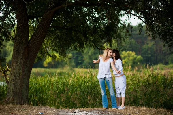 Autumn portrait of mother and daughter — Stock Photo, Image