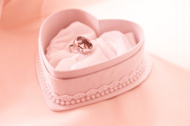 Two wedding ring in the heart shaped box clipart