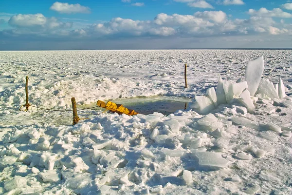 stock image Hole cut through the ice of the river