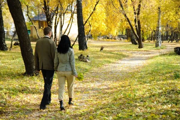 Man and woman going out from park — Stock Photo, Image