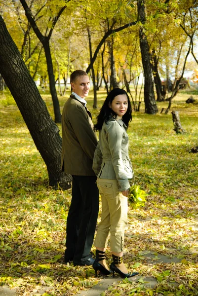 Man and woman going out from park — Stock Photo, Image