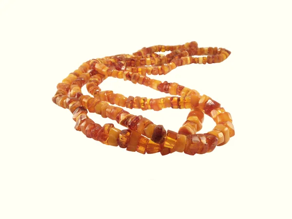 Amber beads on white background — Stock Photo, Image