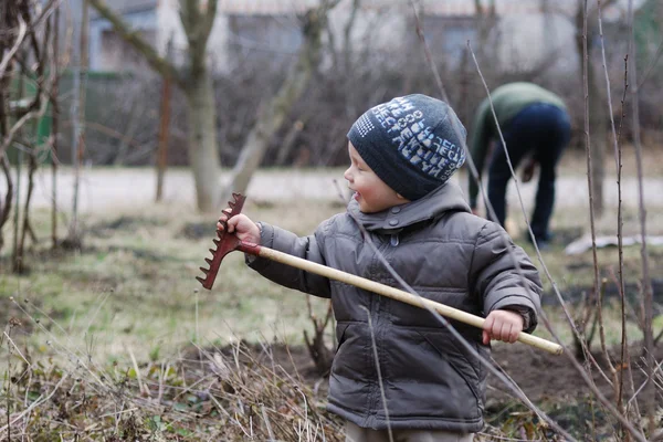 Small boy with rake — Stock Photo, Image