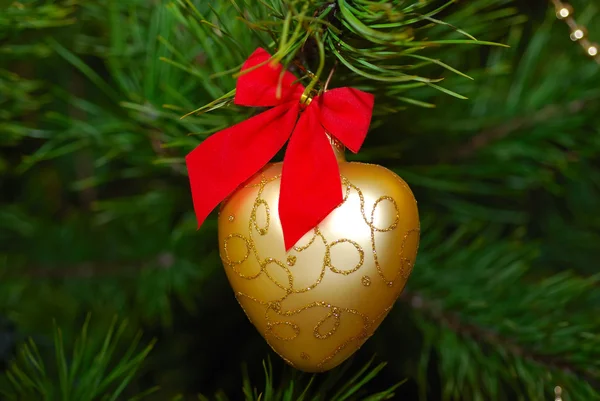 stock image Golden heart on a Christmas tree