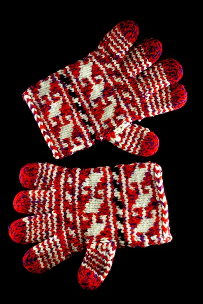 Winter red gloves isolated on black — Stock Photo, Image