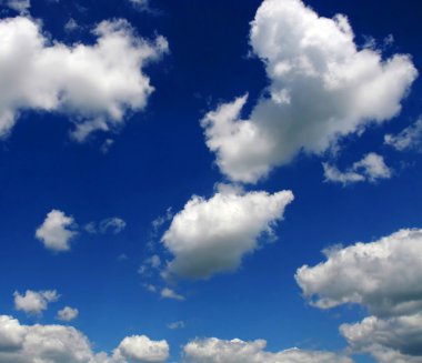 Beatiful white clouds on a blue sky clipart