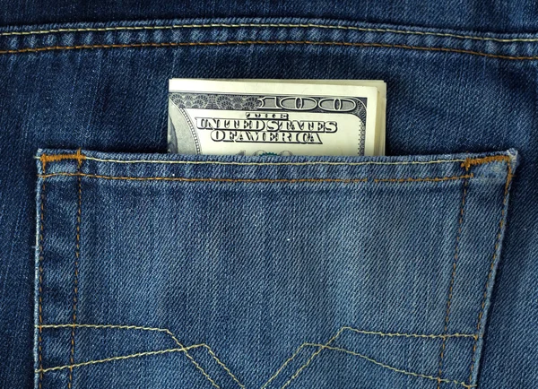 Poche jeans bleu avec billets de 100 $ — Photo