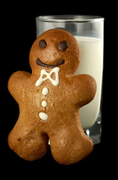 stock image Gingerbread man with a glass of milk