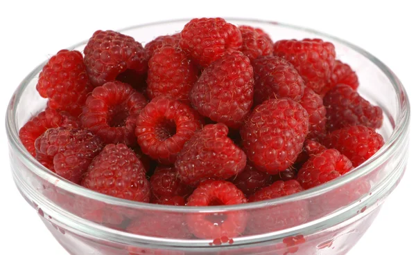 Ripe raspberries in a glass bowl Royalty Free Stock Photos