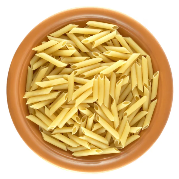 Raw pasta on the ceramic plate — Stock Photo, Image