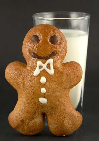 Gingerbread man with a glass of milk Stock Image